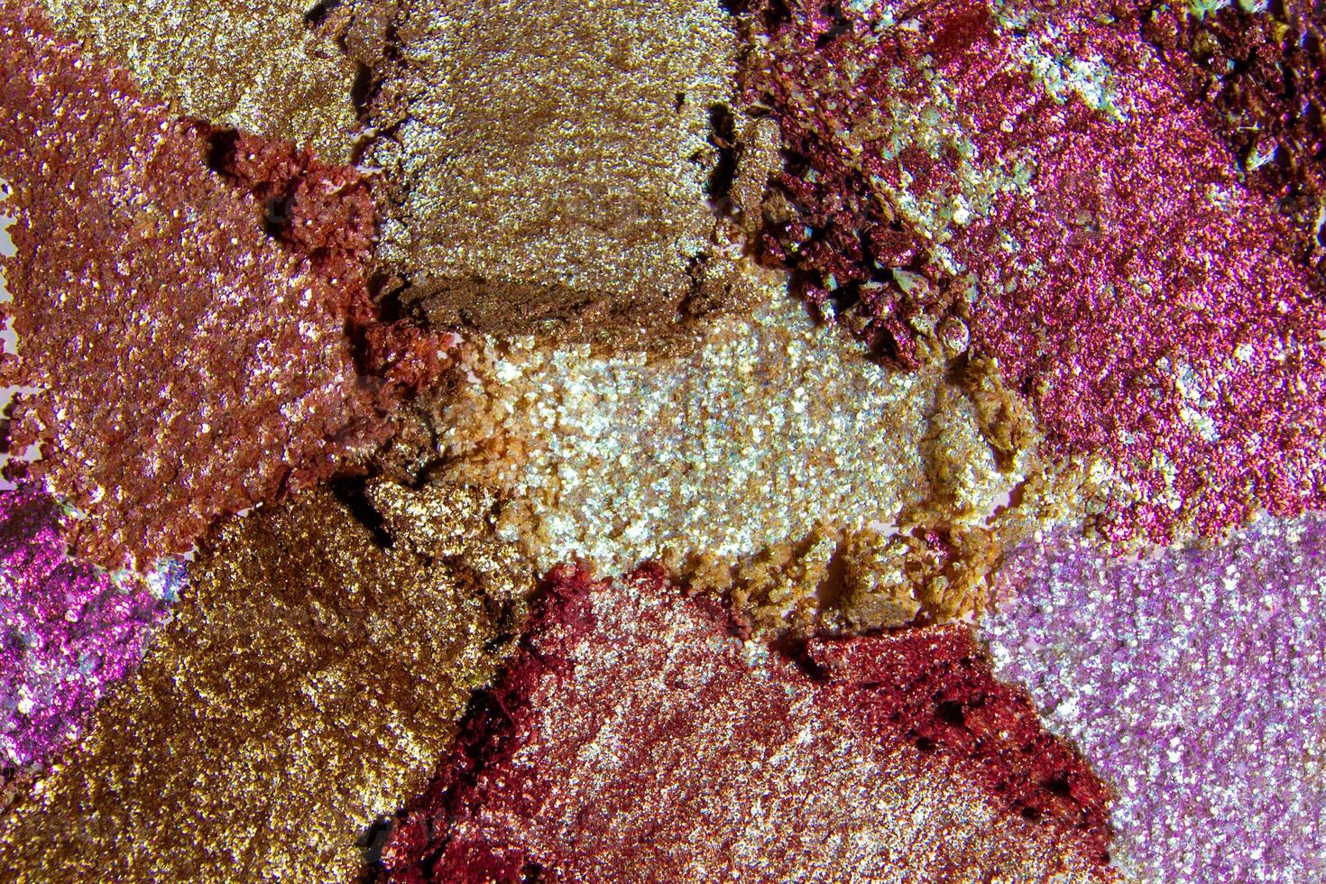 Close up of bright and colorful shimmery eyeshadows photo