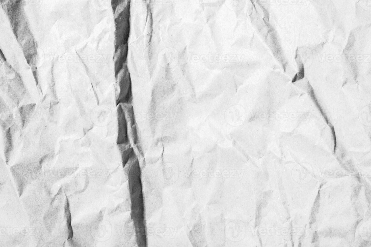 Crumpled light paper texture. Wrinkled surface, abstract background. photo