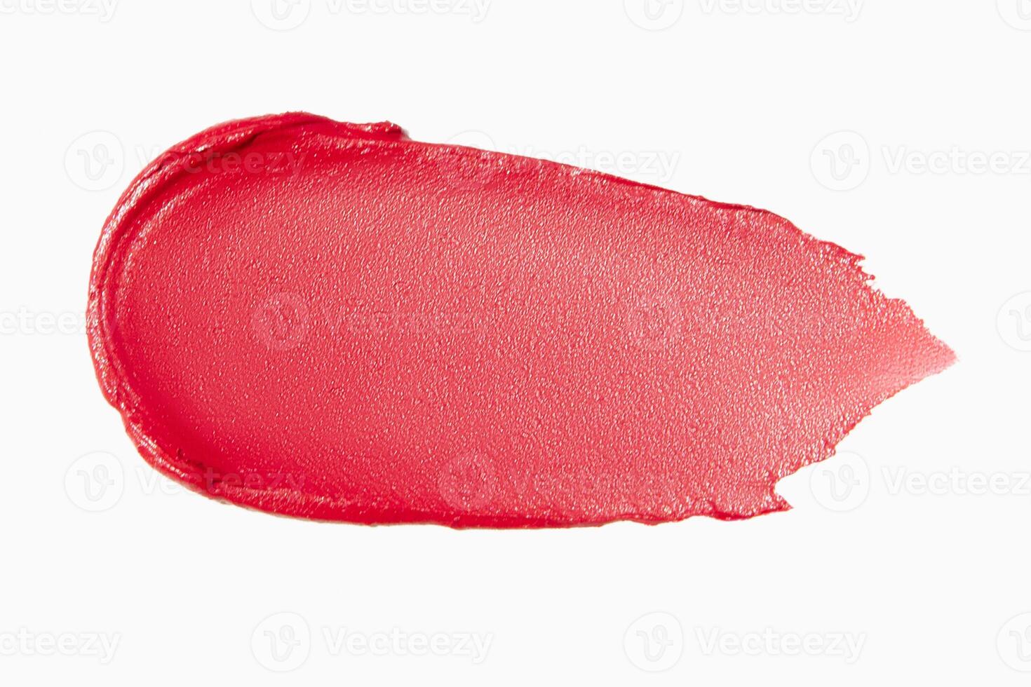 Matte red lipstick smear on a light white background. Cosmetic texture. photo