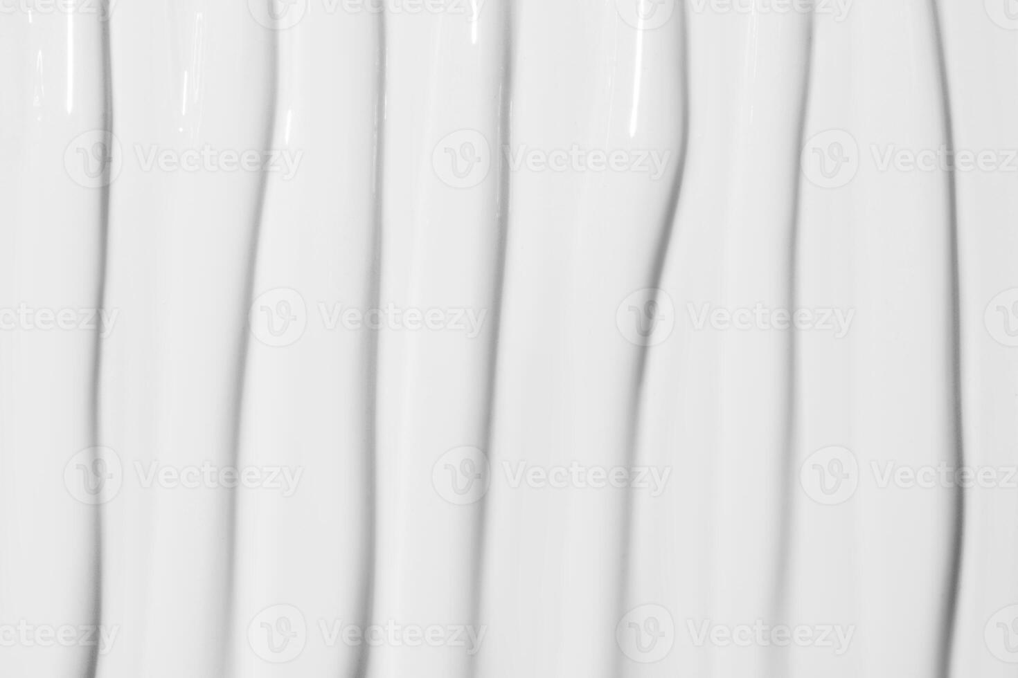 Texture of white cosmetic cream covering the entire image. Skincare background, soft and smooth surface. photo