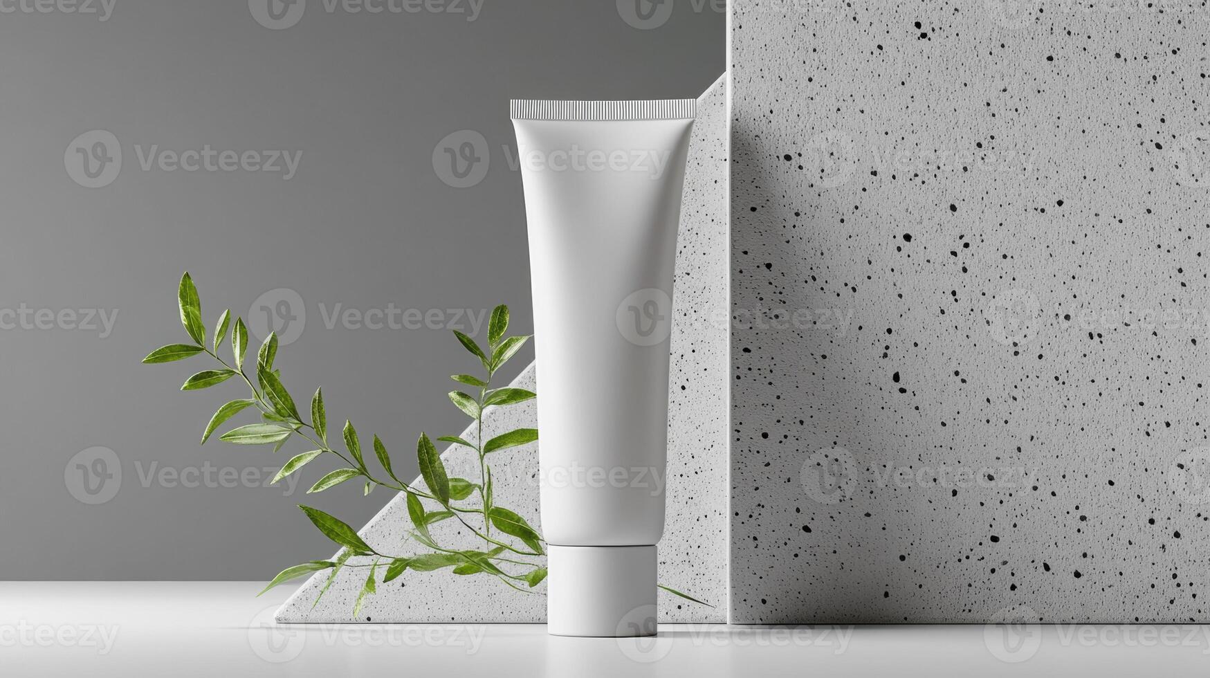 Mockup of cosmetic tube cream 50ml on concrete stone stand on gray background minimalist with green leaves. No branding, label template. Natural hard lighting and shadows photo