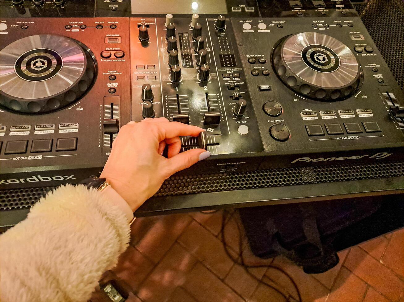 Prague- Czech- 23 November 2024. Close up DJ mixer controller panel for playing music and partying. photo