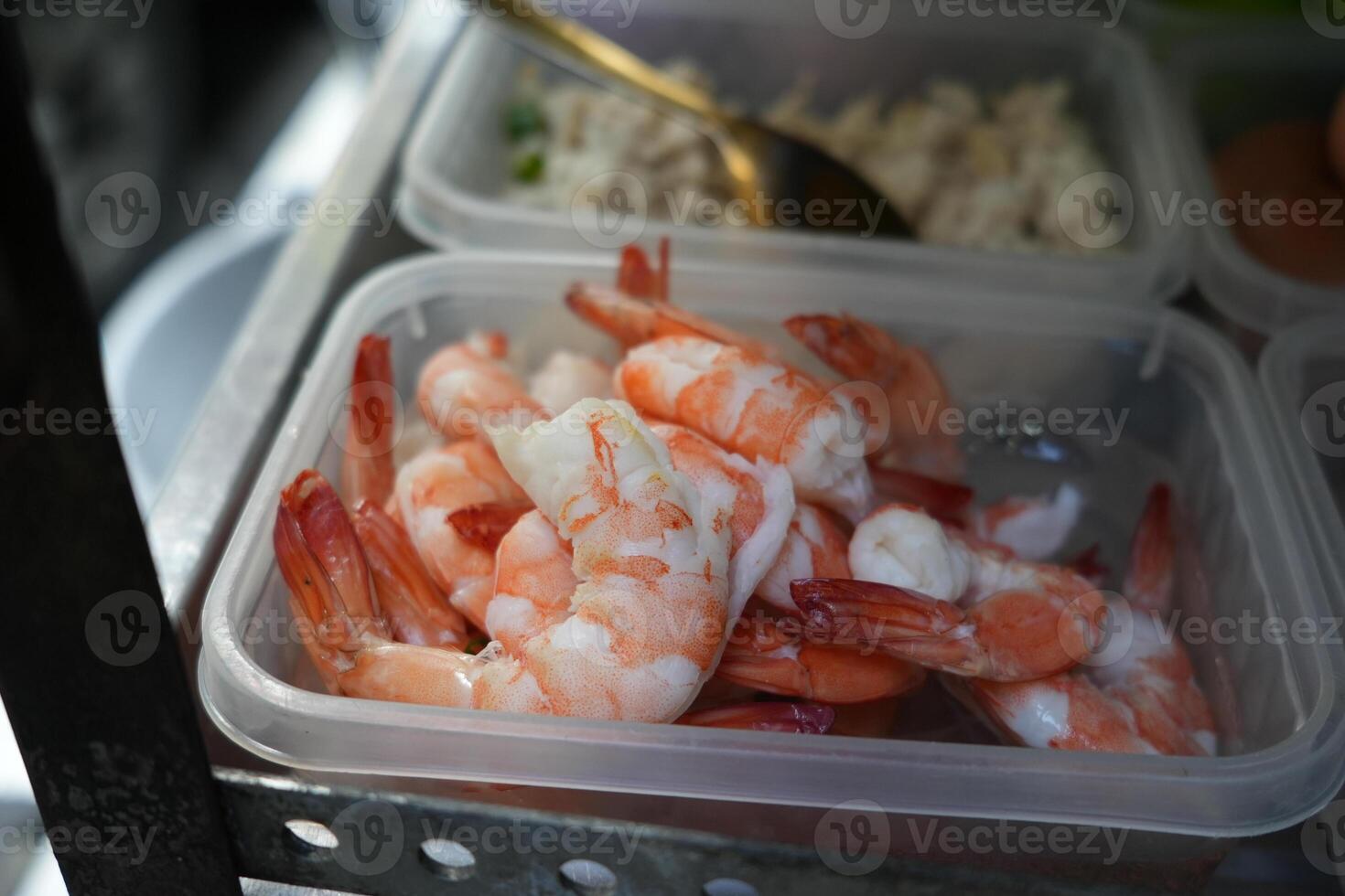 close up view of a fresh shrimp,for a dish made with shrimp, like a fried rice, on street stall vendor on bangkok photo