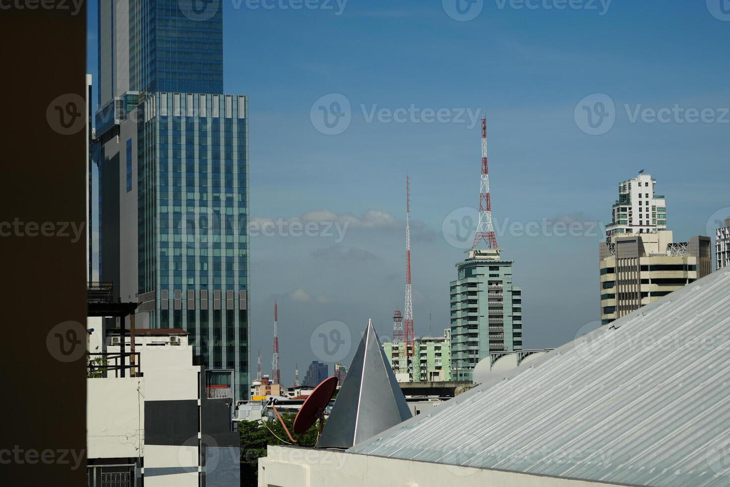 view of Bangkok cityscape. Modern cityscape surrounded with architectural building with day light and blue sky. Business background theme photo