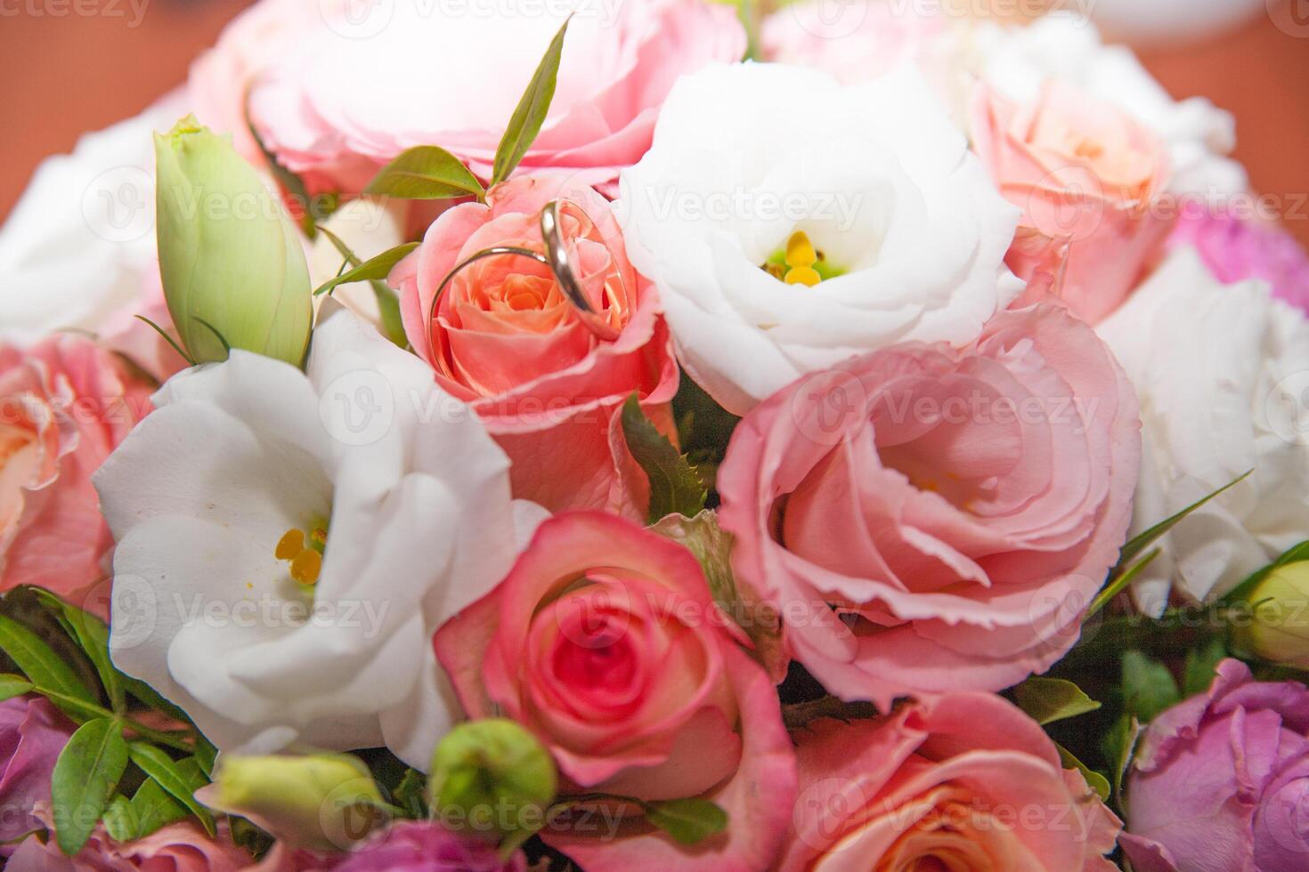 wedding rings with bouquet photo