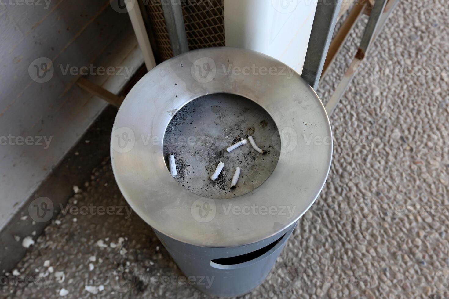 cigarette butts in an ashtray photo