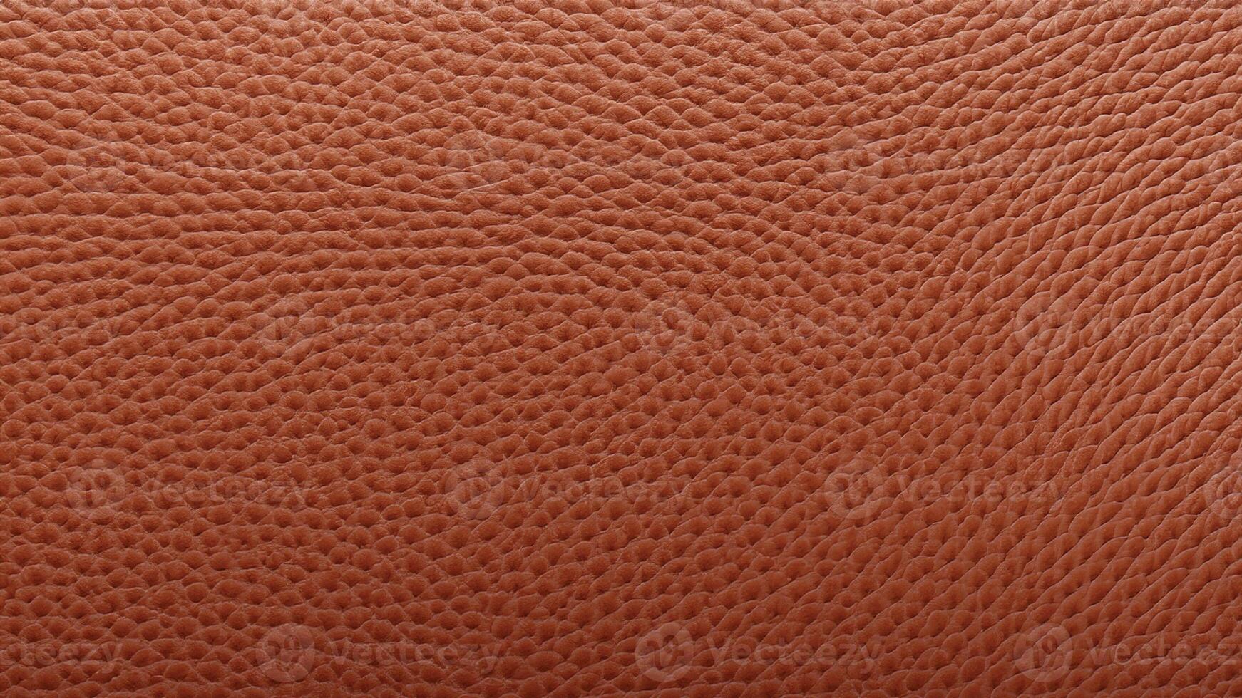 A smooth tan leather texture with subtle grain patterns, perfect for minimalist branding, elegant product packaging, and creative decorative applications. photo