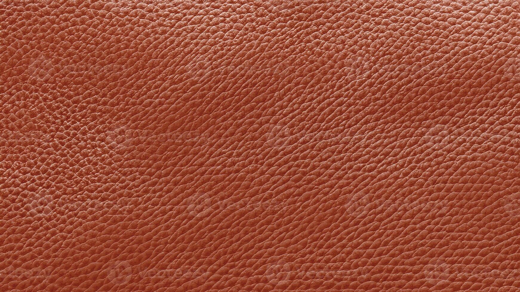 A vibrant orange leather texture with fine grain patterns and a glossy finish, offering a bold and dynamic look for luxury branding, artistic visuals, and product designs. photo
