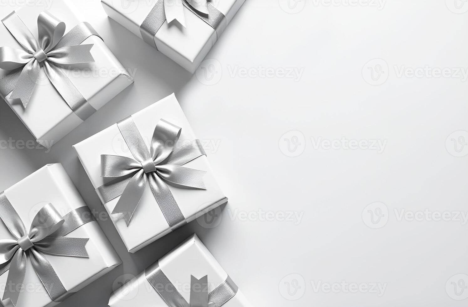 White boxes with silver bows on white background photo