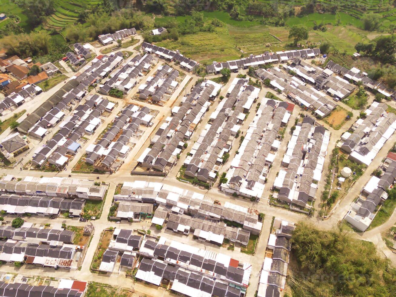 High angle view of Real Estate from 200 meters high. A real estate built on the outskirts of Bandung City, Indonesia. Housing and Settlement. Drone Photography Themes photo