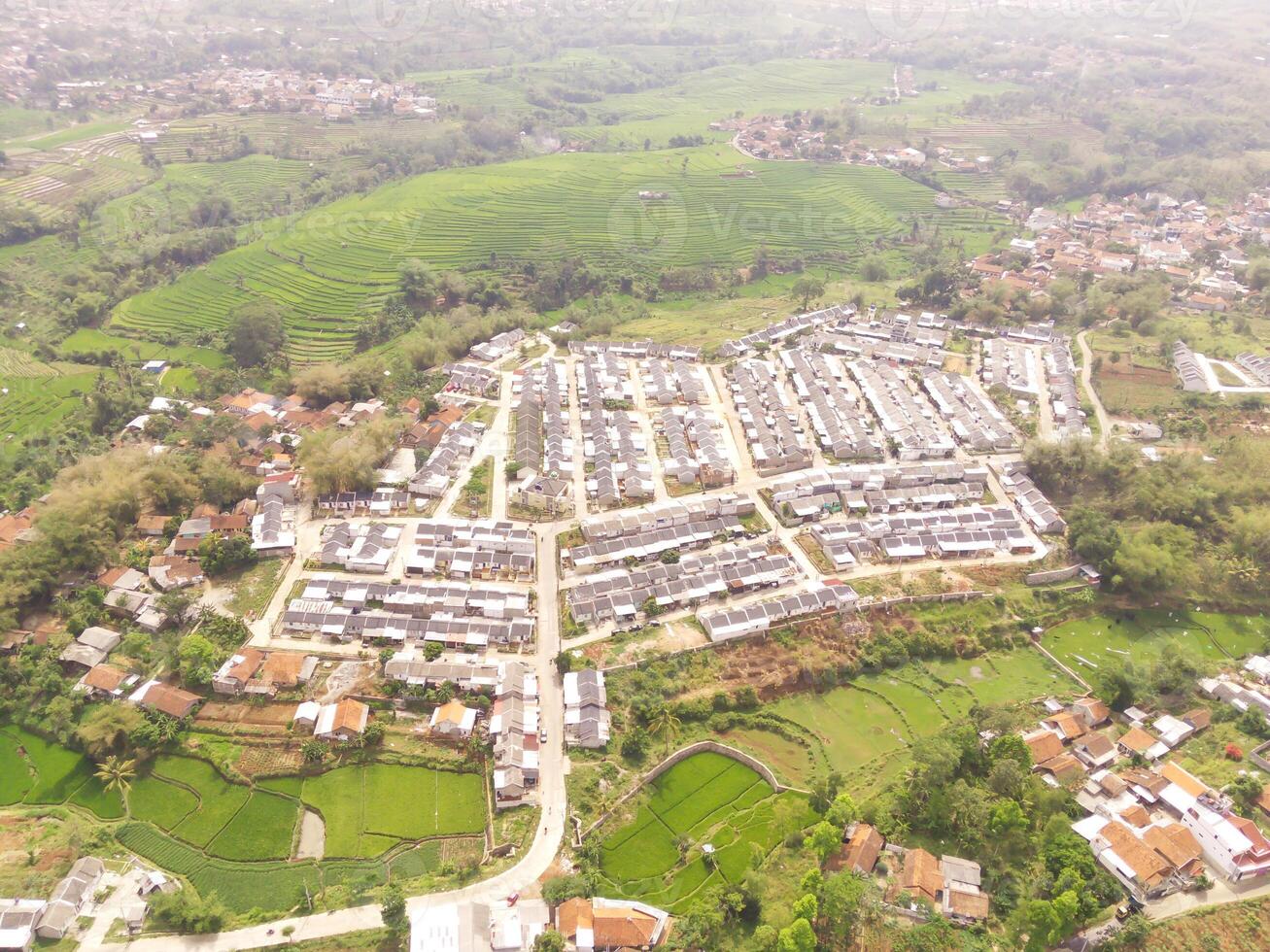 High angle view of Real Estate from 200 meters high. A real estate built on the outskirts of Bandung City, Indonesia. Housing and Settlement. Drone Photography Themes photo