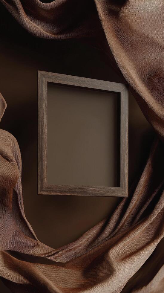Unique wooden frame on a backdrop of flowing brown fabric in an artistic setting photo