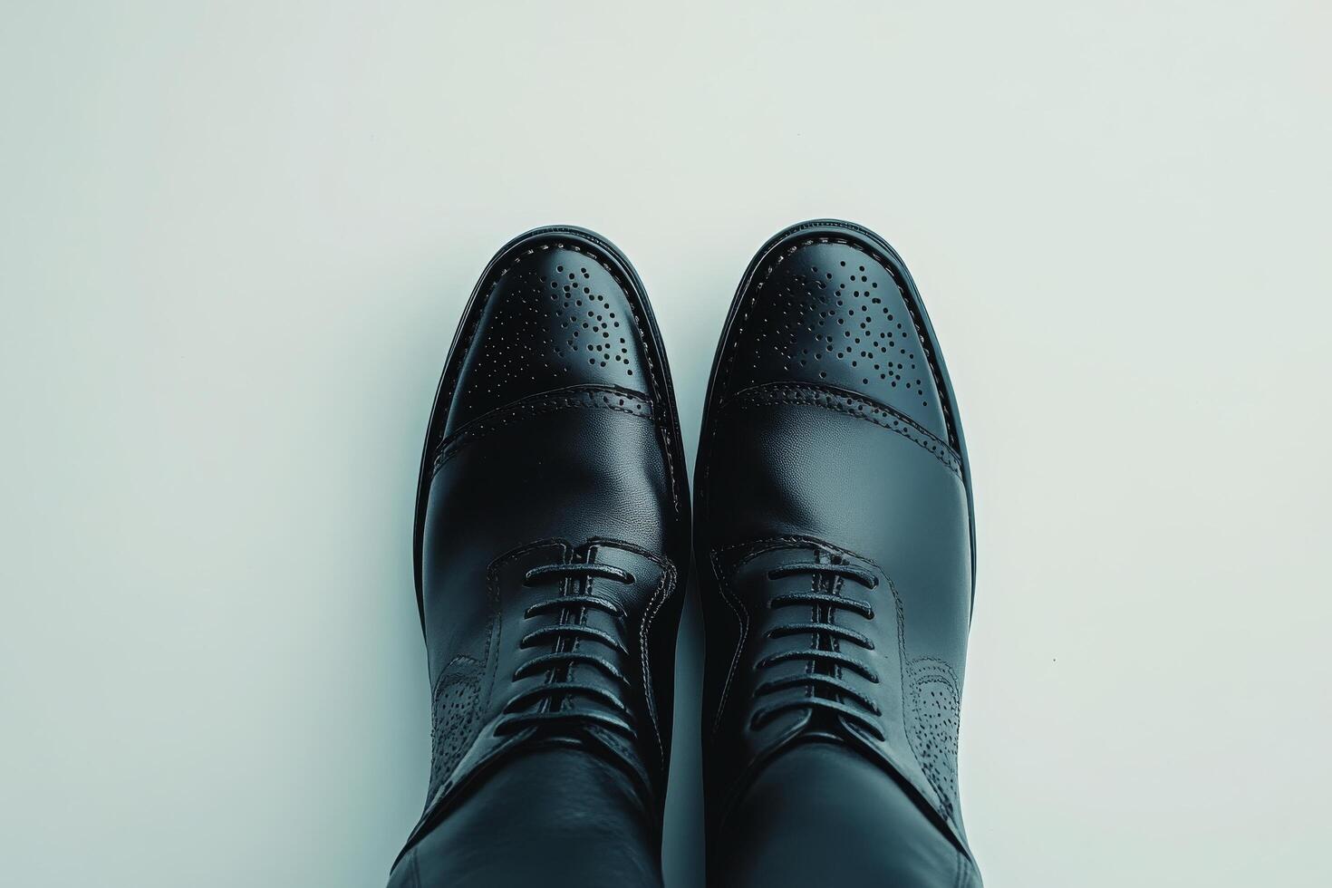 Elegant black dress shoes displayed on a clean surface for fashion and style inspiration photo