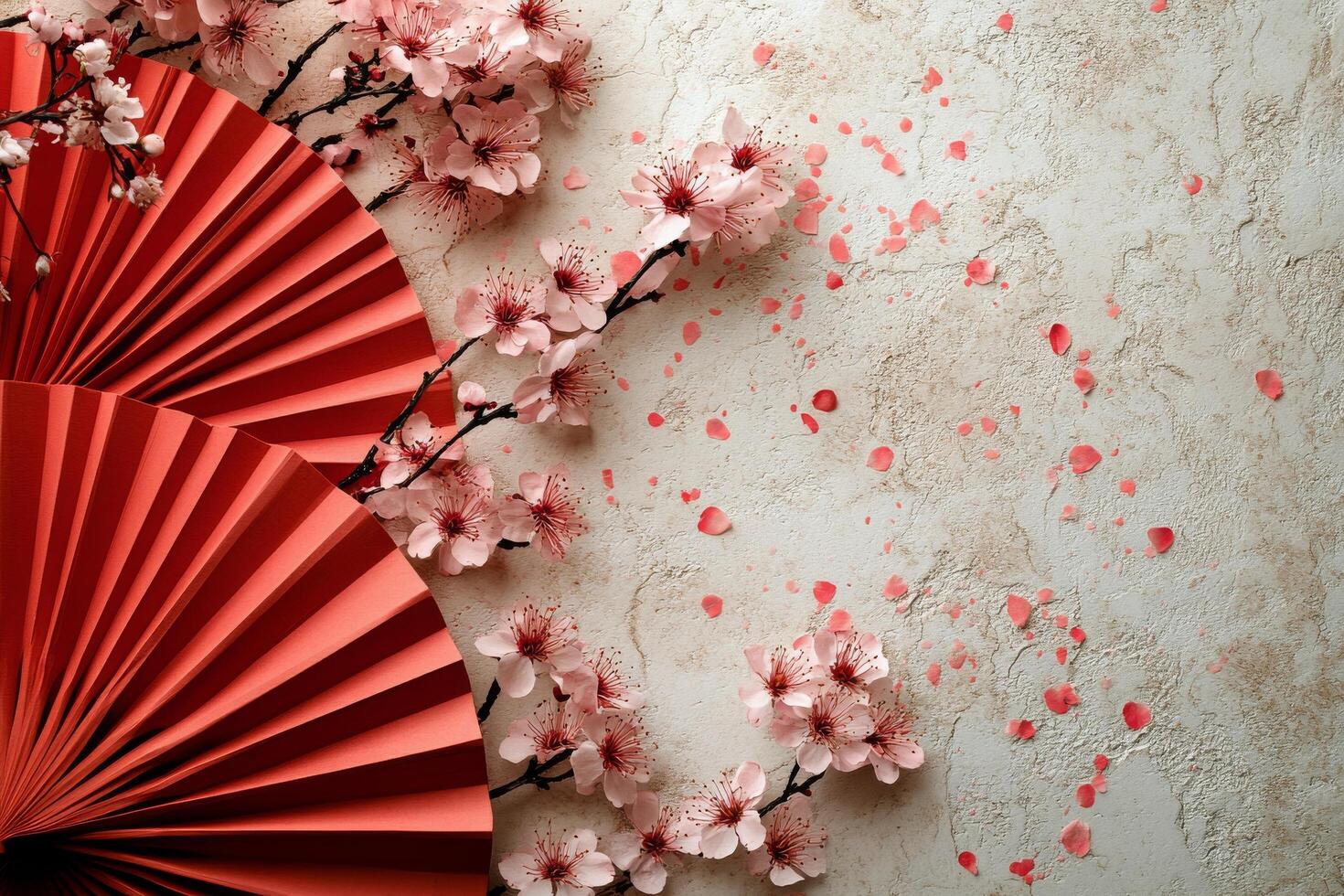Colorful paper fans and cherry blossoms create a vibrant decorative display on a blue background photo