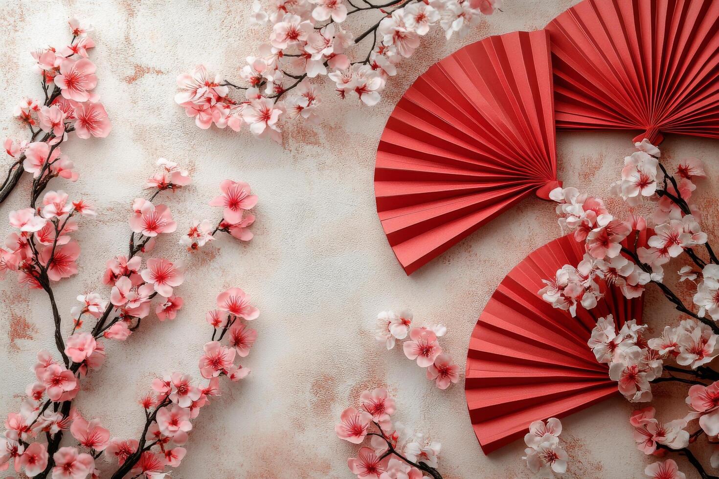 Colorful paper fans and cherry blossoms create a vibrant decorative display on a blue background photo