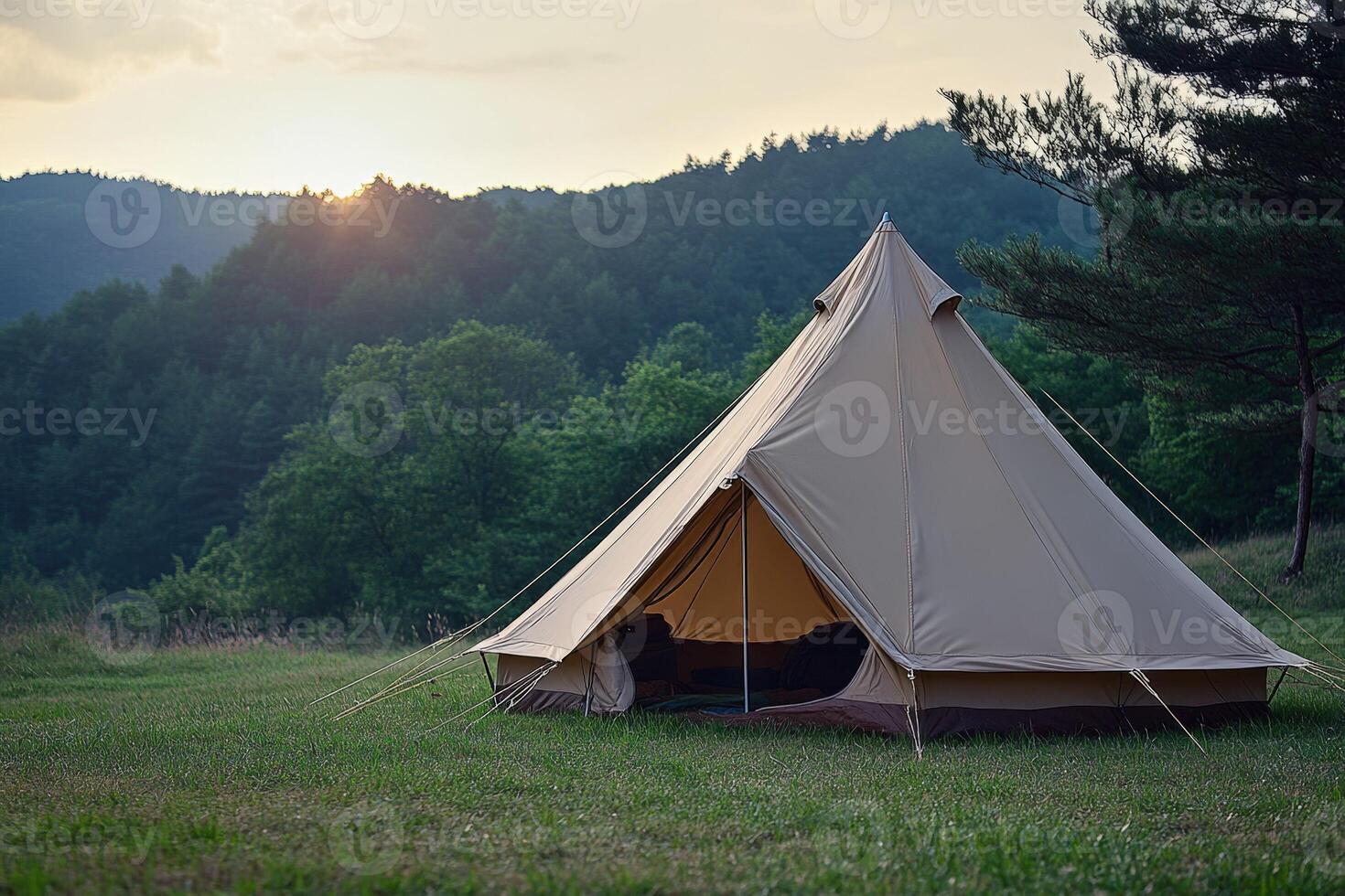 A tent is set up in the middle of a field photo