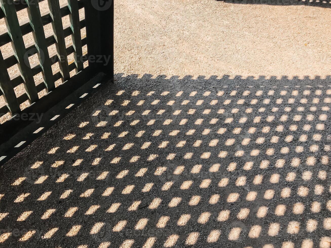 A black and white photo of a patio with a black and white patterned floor
