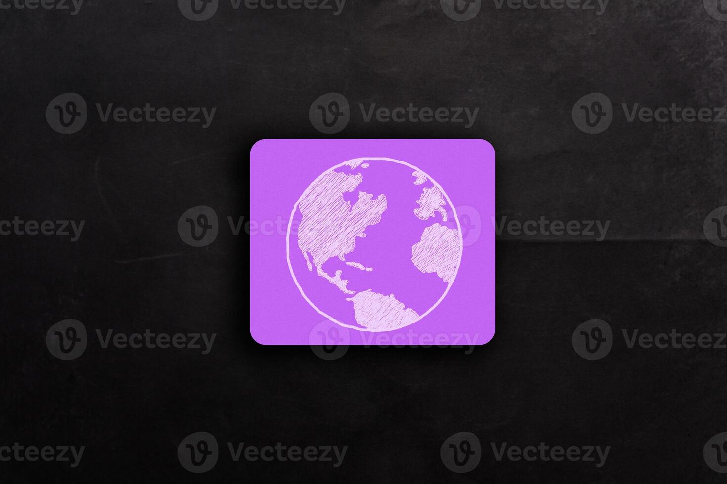 Purple mouse pad with a drawing of the earth on it photo