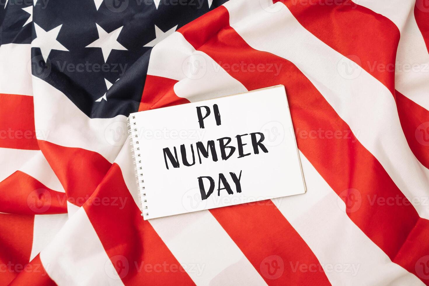 White sign with the word pi written on it is placed on top of a red photo