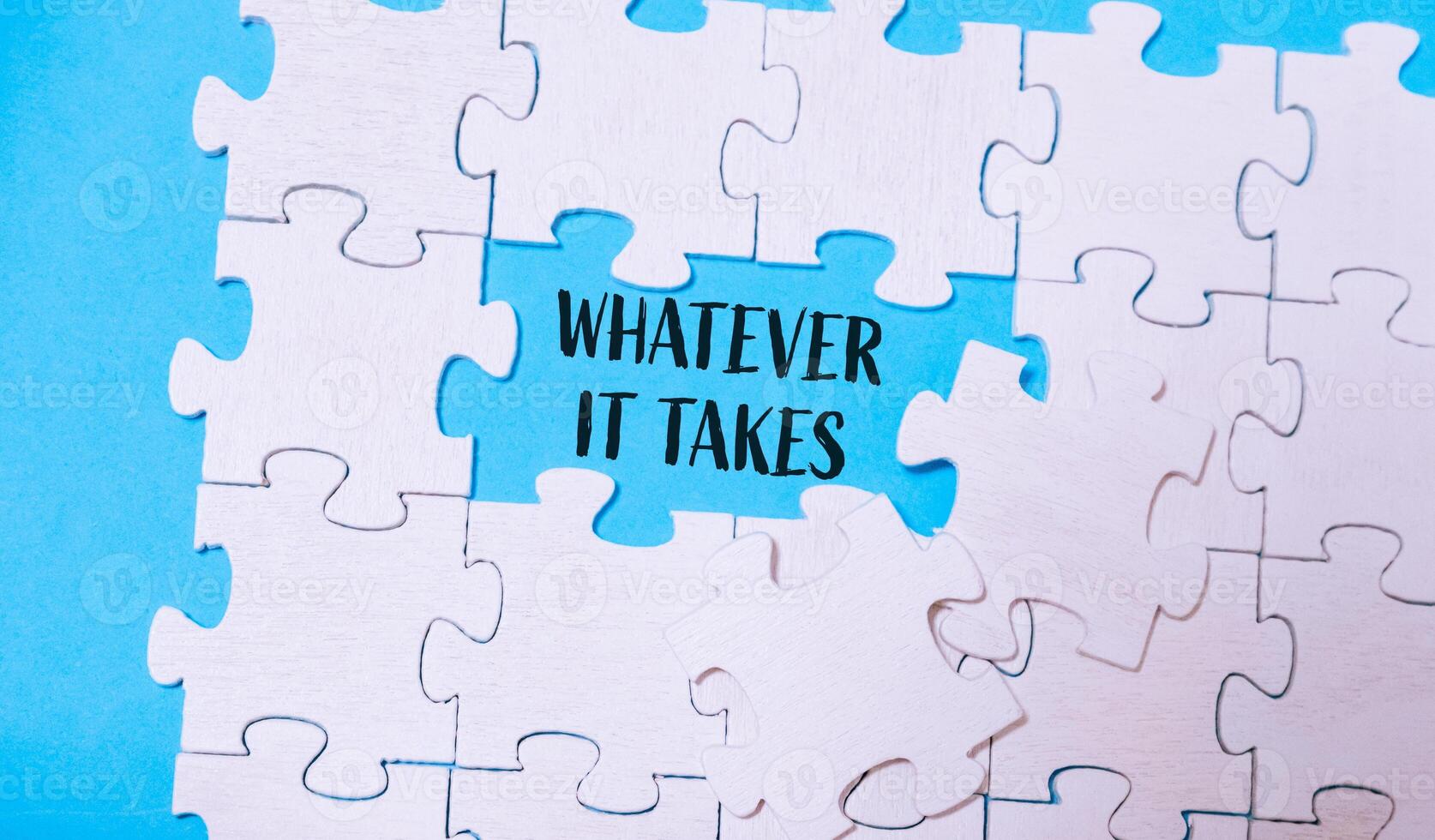 Puzzle with the words whatever it takes written in the middle photo
