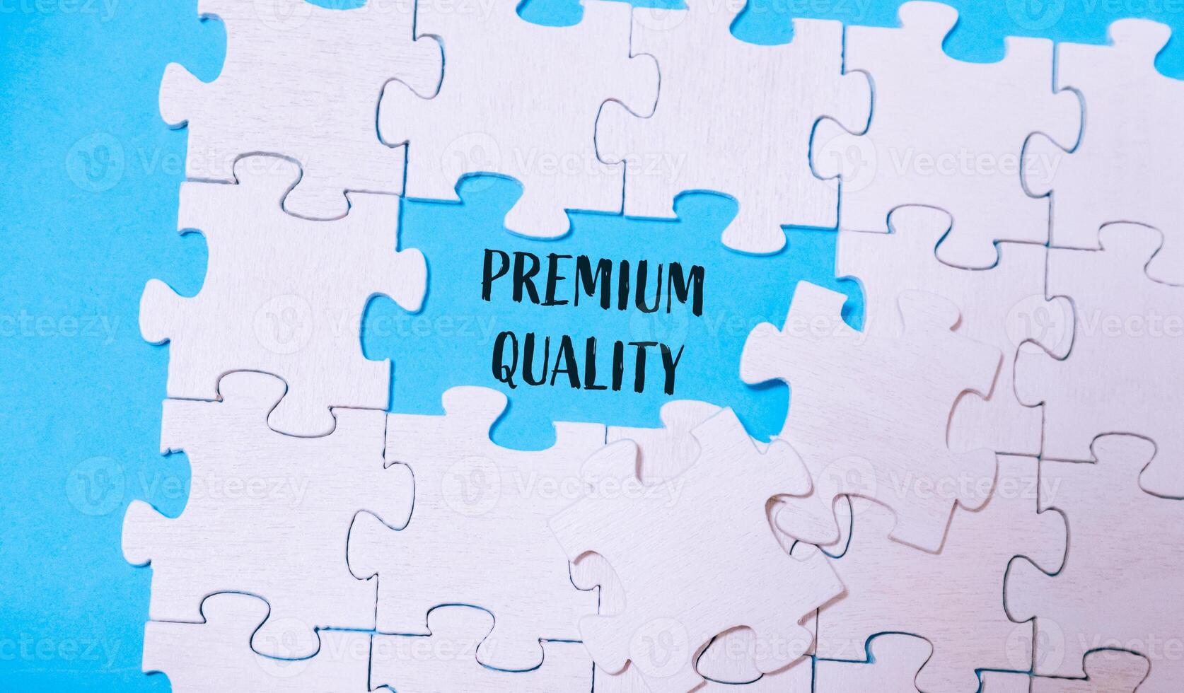 Puzzle with a piece missing and the word premium quality written in the gap photo