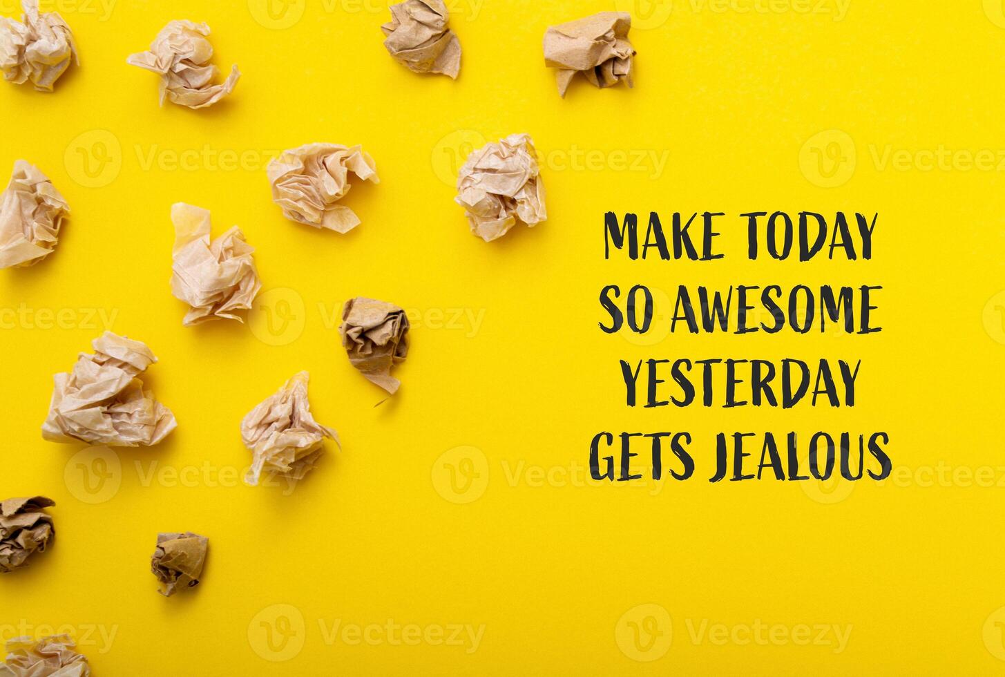 Yellow background with a bunch of crumpled paper on it photo