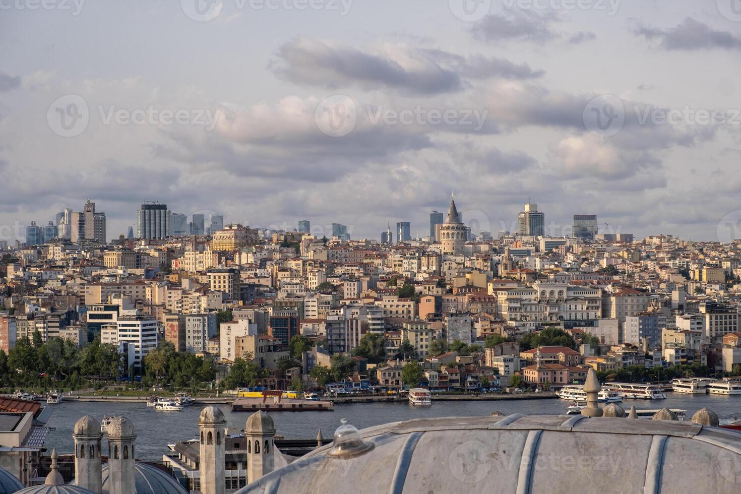 A panoramic view captures the bustling skyline of Istanbul along the Bosphorus, photo