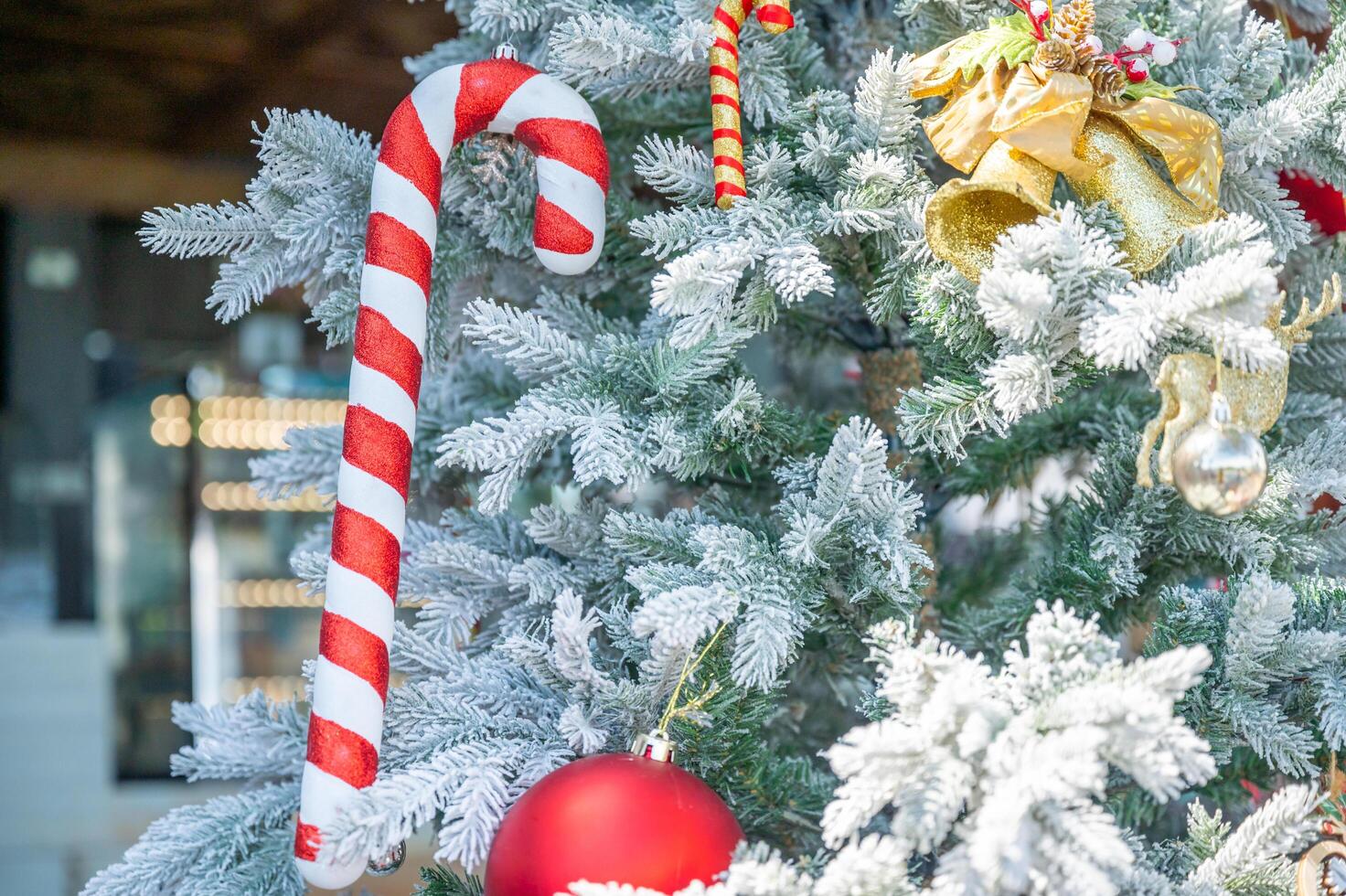 Christmas tree decorated with red and white stars and balls. Selective focus photo