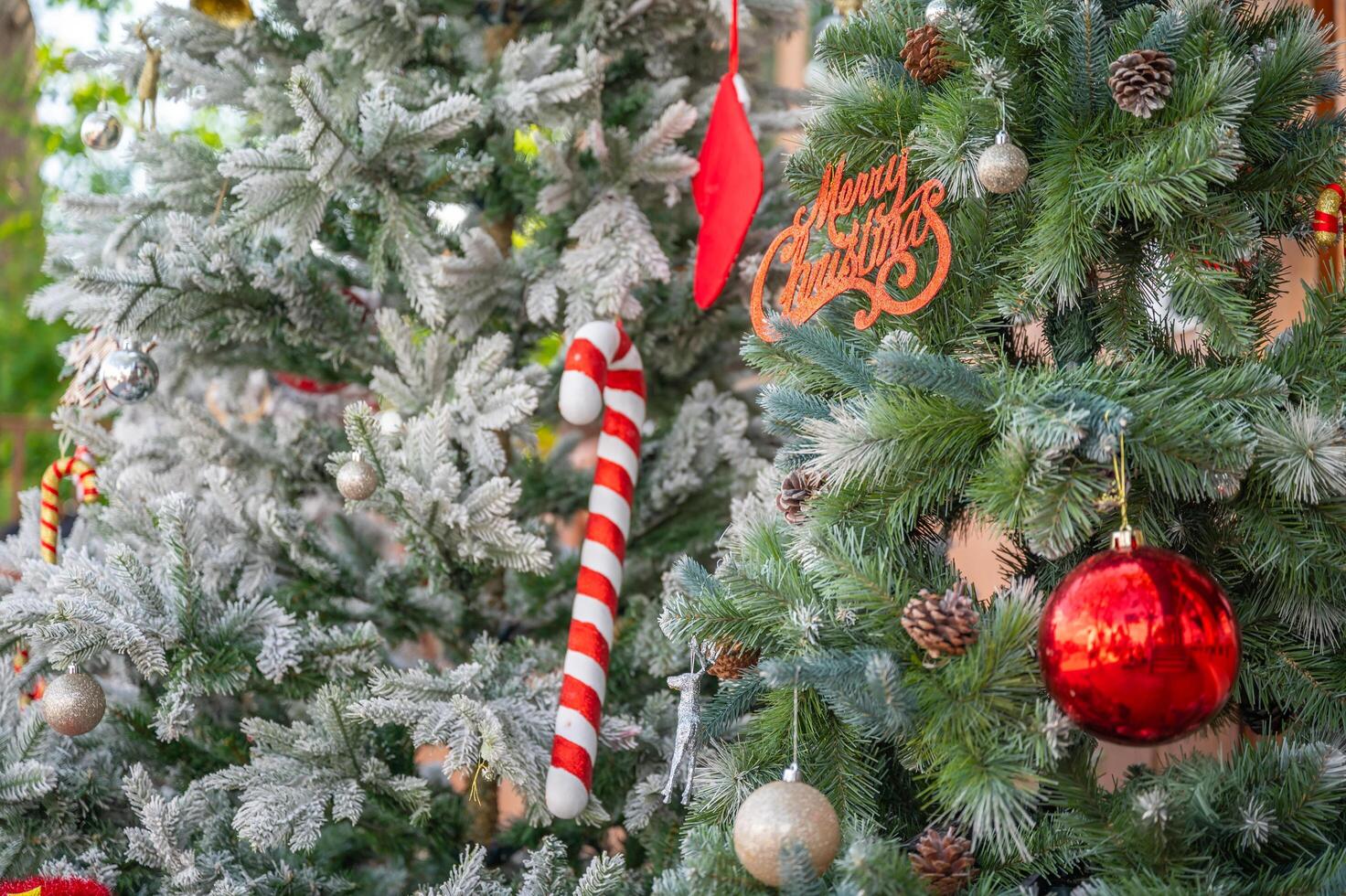Christmas tree decorated with red and white stars and balls. Selective focus photo