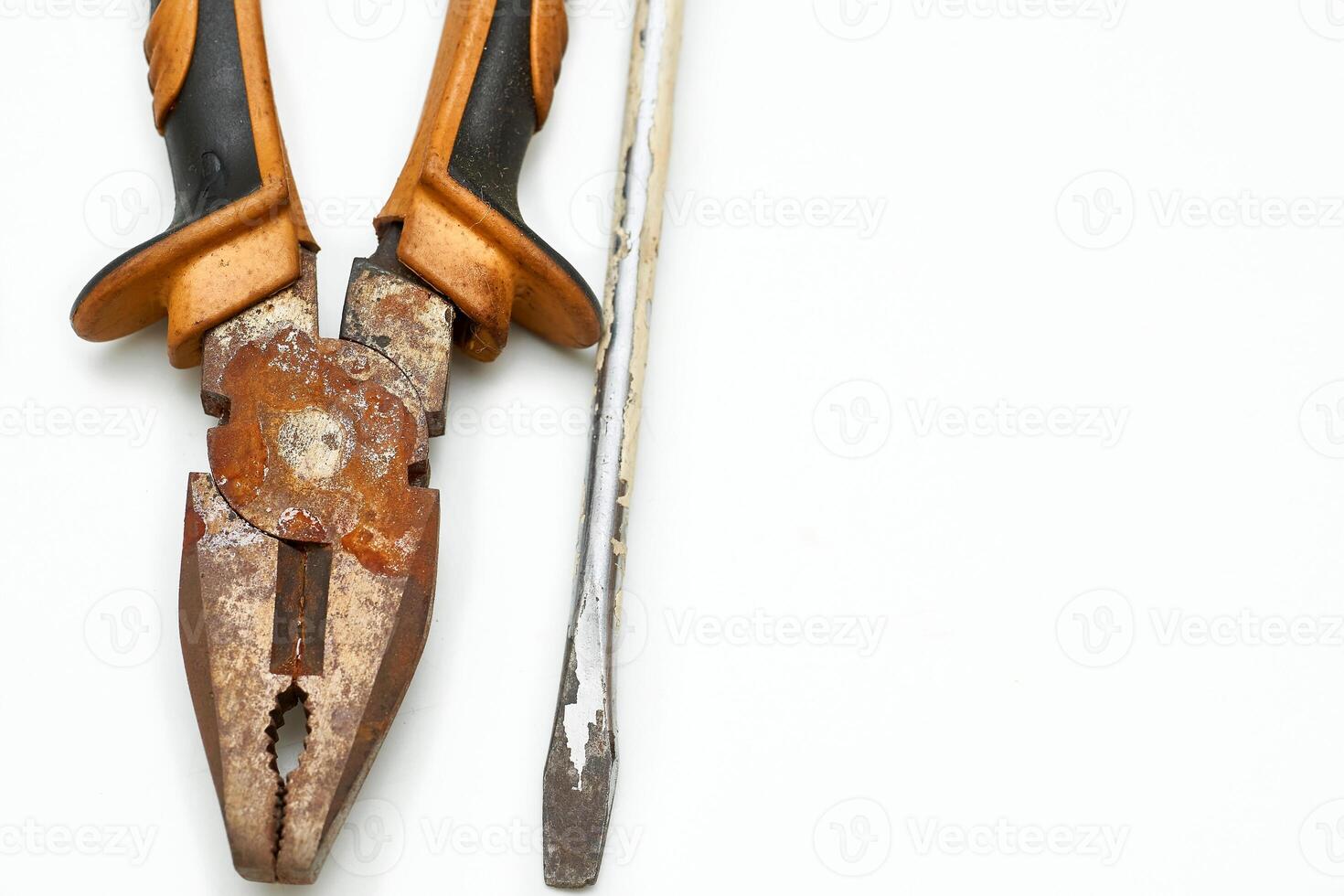 Old rusty pliers,screwdriver covered in paint from the home shed for repair photo