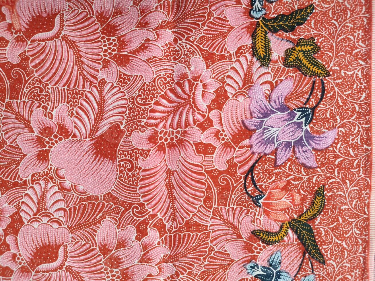 Indonesian batik patterns and backgrounds with images of flowers and leaves in many colors photo
