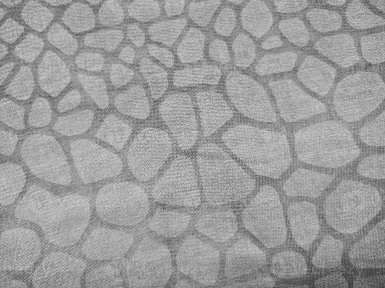 The texture, pattern and background of the grey animal skin patterned fabric photo