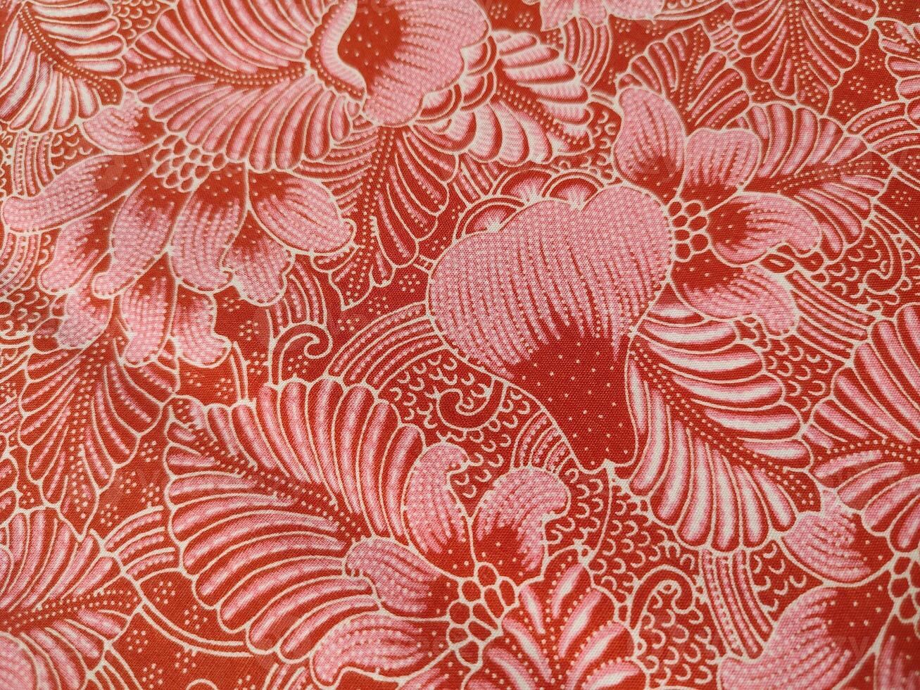 Traditional Chinese floral print pattern on red fabric photo