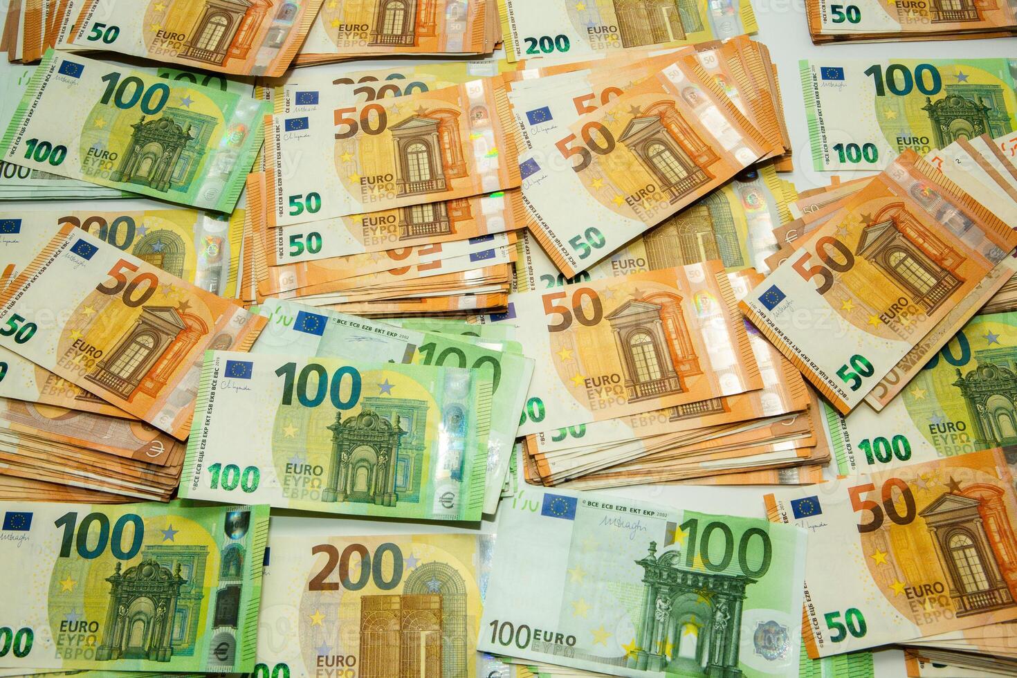 Euro banknote cash money. Lot of banknotes of European union currency close up. Financial investment, savings, income earnings concept. photo