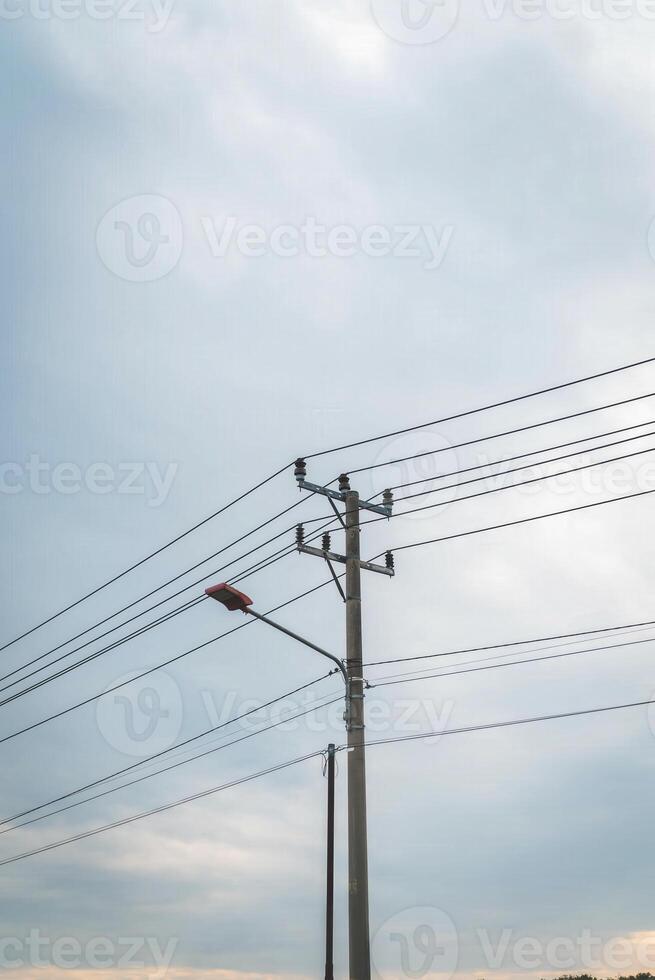A street light is on top of a telephone pole photo