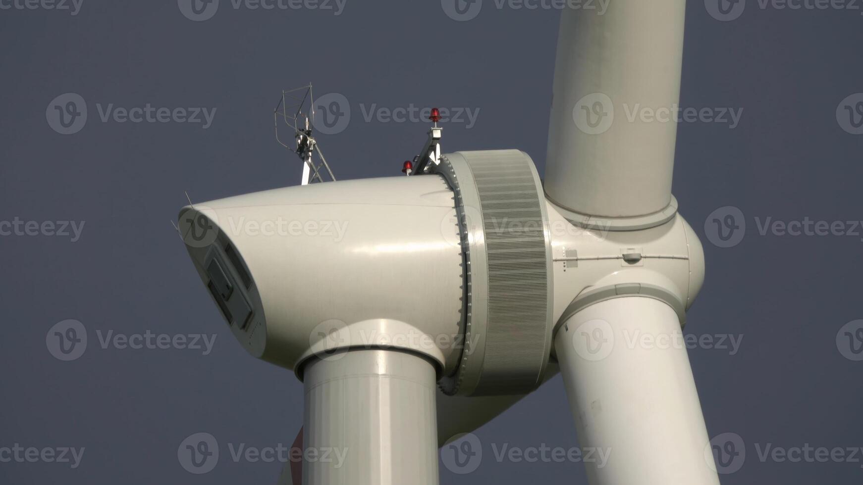 Windmill or wind turbine closeup in rotation photo