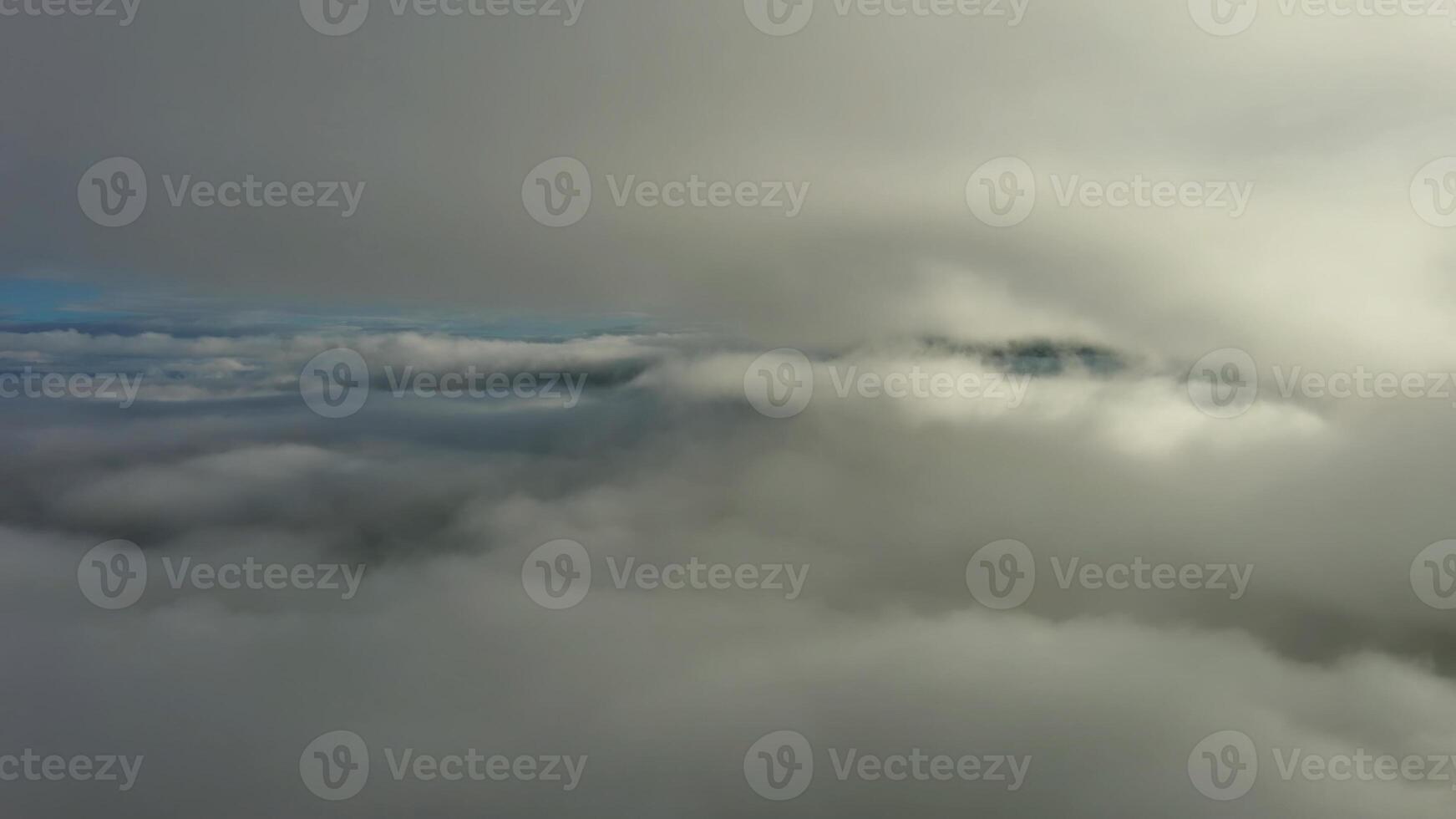 Aerial view of clouds and mountains at sunrise photo