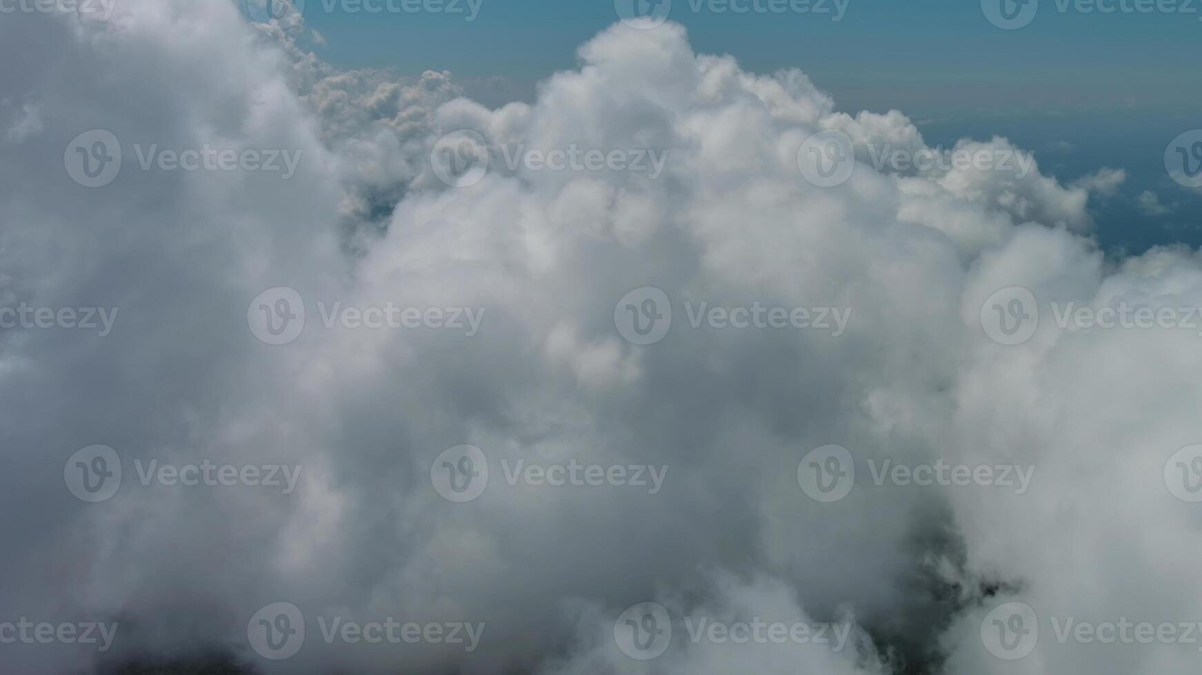 Flying through white fluffy clouds photo