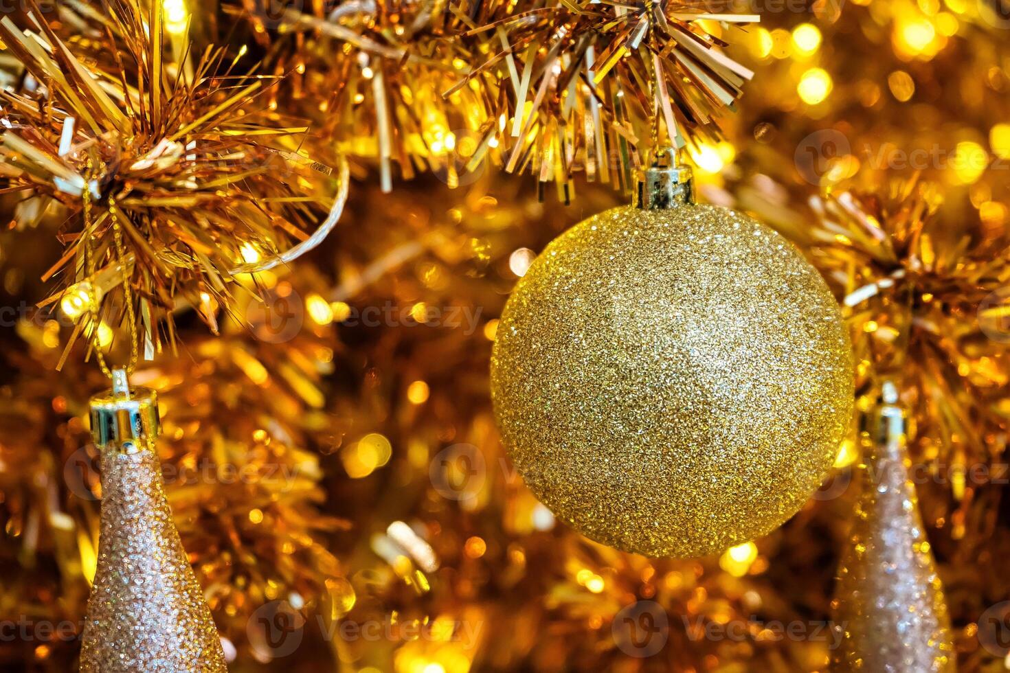 Luxurious Golden Christmas Tree Adorned with Sparkling Ornaments for the Holidays photo