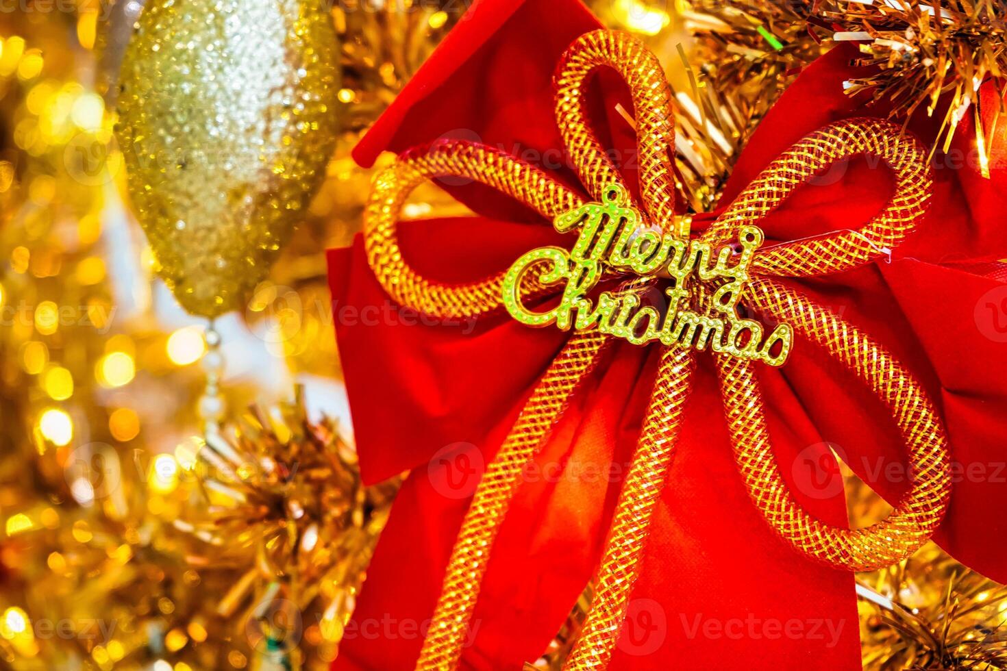 Luxurious Golden Christmas Tree Adorned with Sparkling Ornaments for the Holidays photo