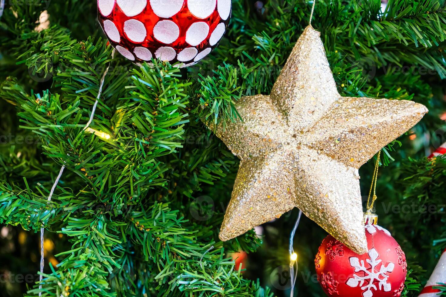 Luxurious Golden Christmas Tree Adorned with Sparkling Ornaments for the Holidays photo