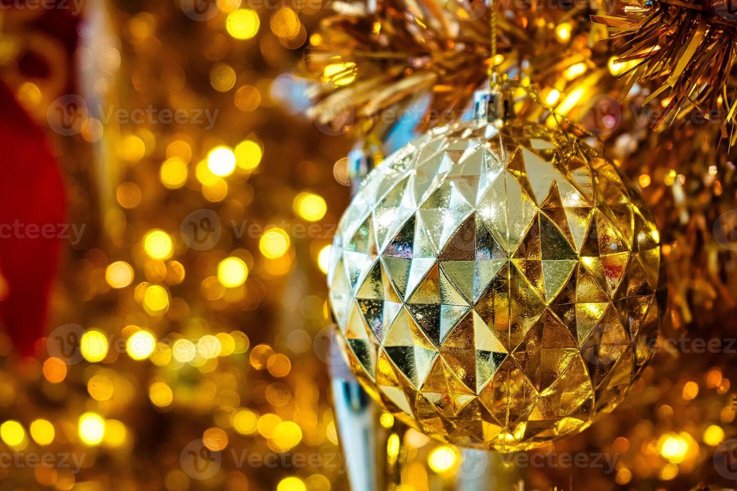 Luxurious Golden Christmas Tree Adorned with Sparkling Ornaments for the Holidays photo