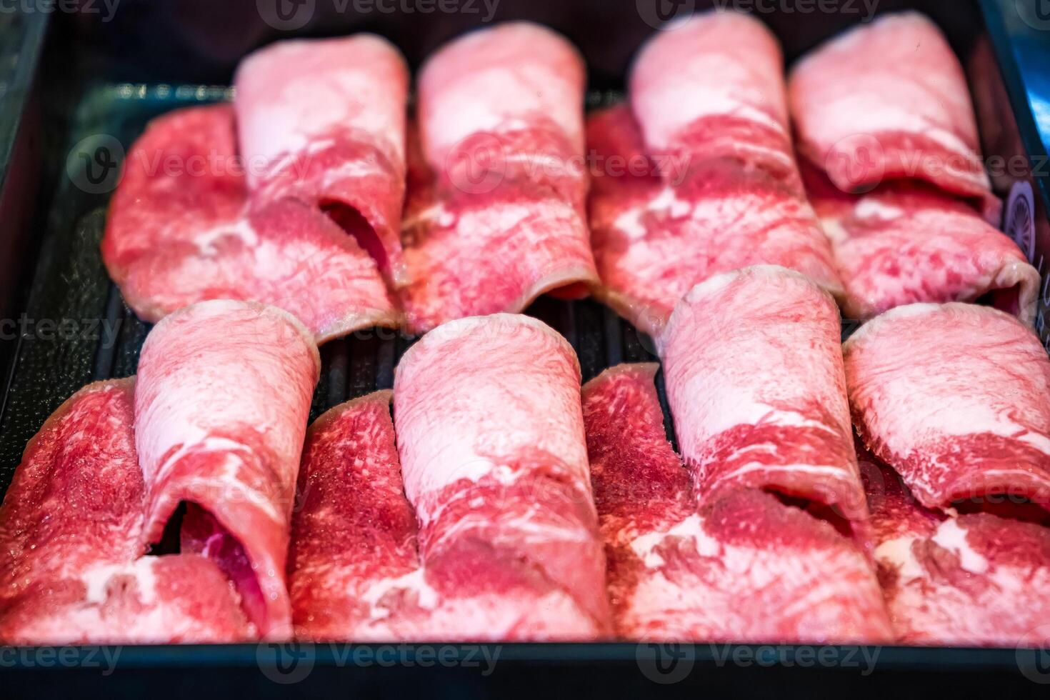 Tender and Juicy Beef Slices Featuring Intricate Marbling, Ready for Hotpot, Grilling, or Stir-Fry photo