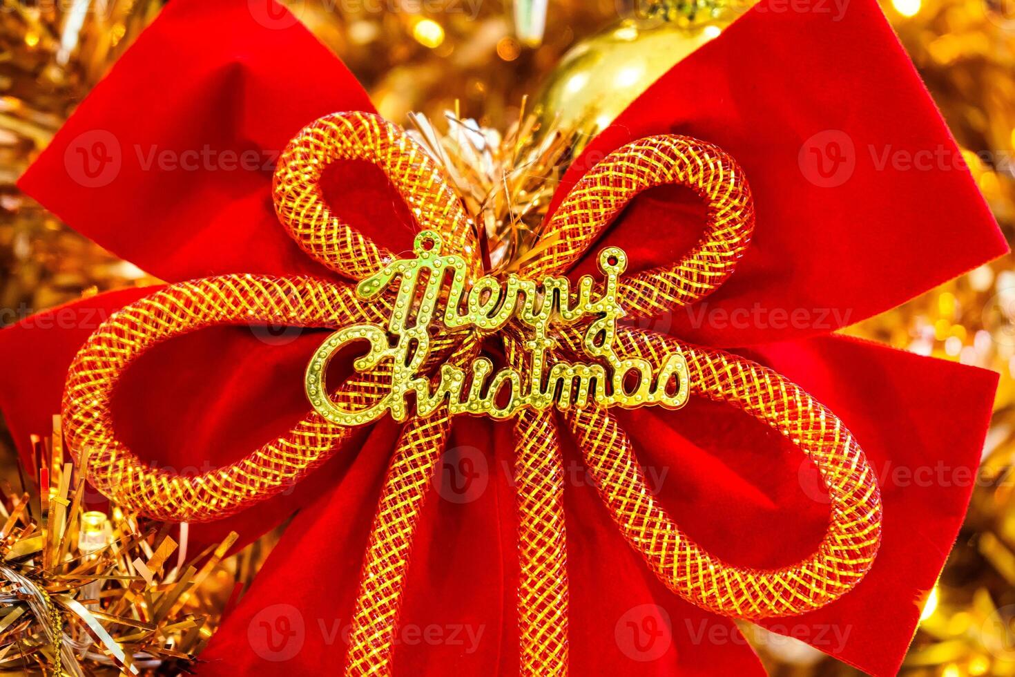 Luxurious Golden Christmas Tree Adorned with Sparkling Ornaments for the Holidays photo