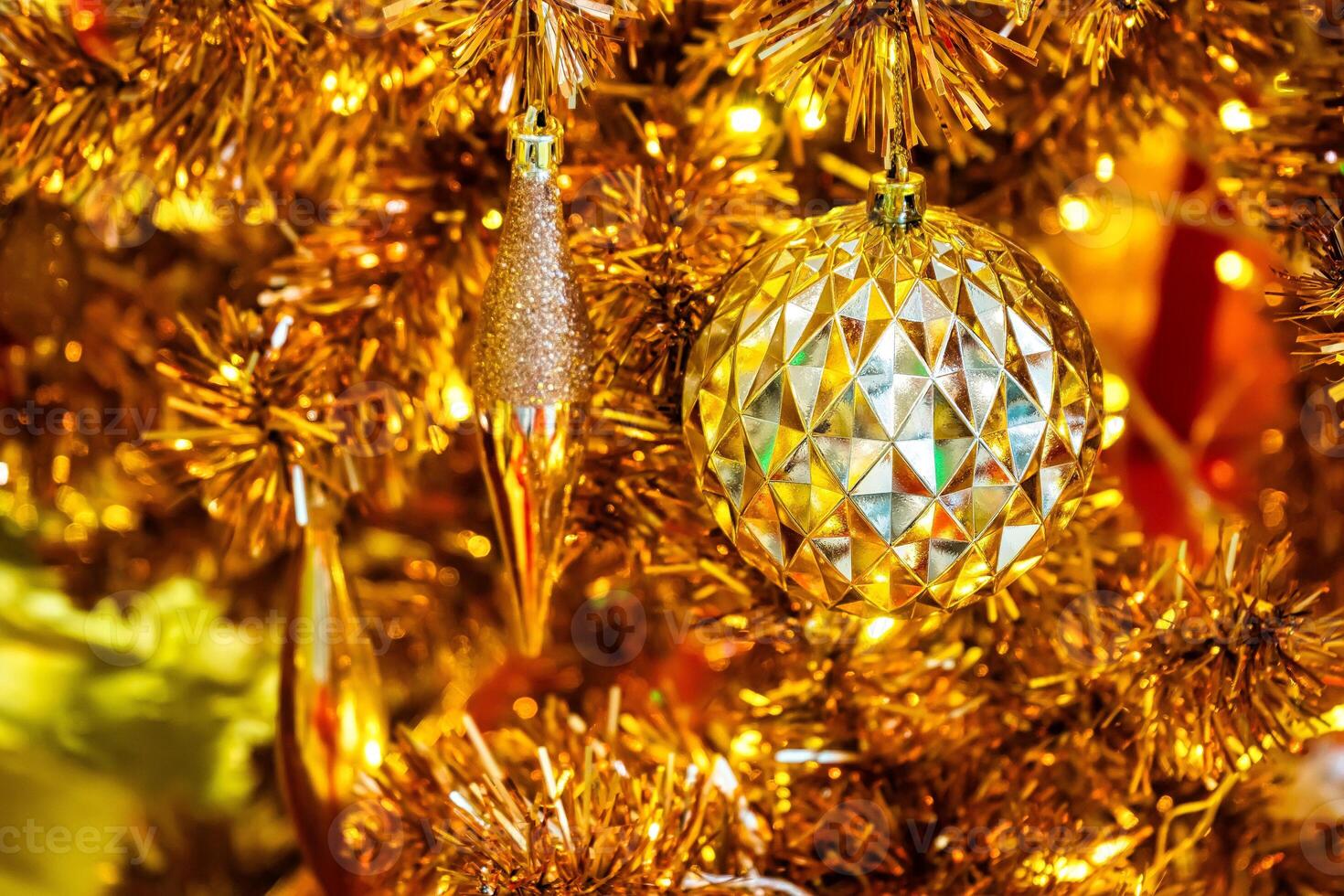 Luxurious Golden Christmas Tree Adorned with Sparkling Ornaments for the Holidays photo