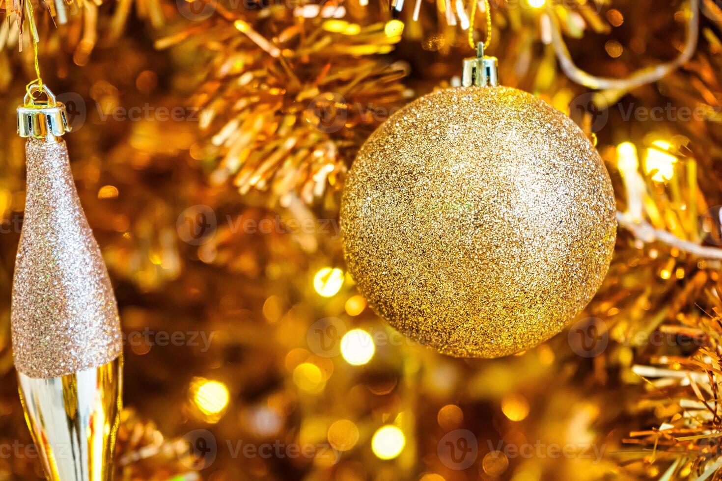 Luxurious Golden Christmas Tree Adorned with Sparkling Ornaments for the Holidays photo
