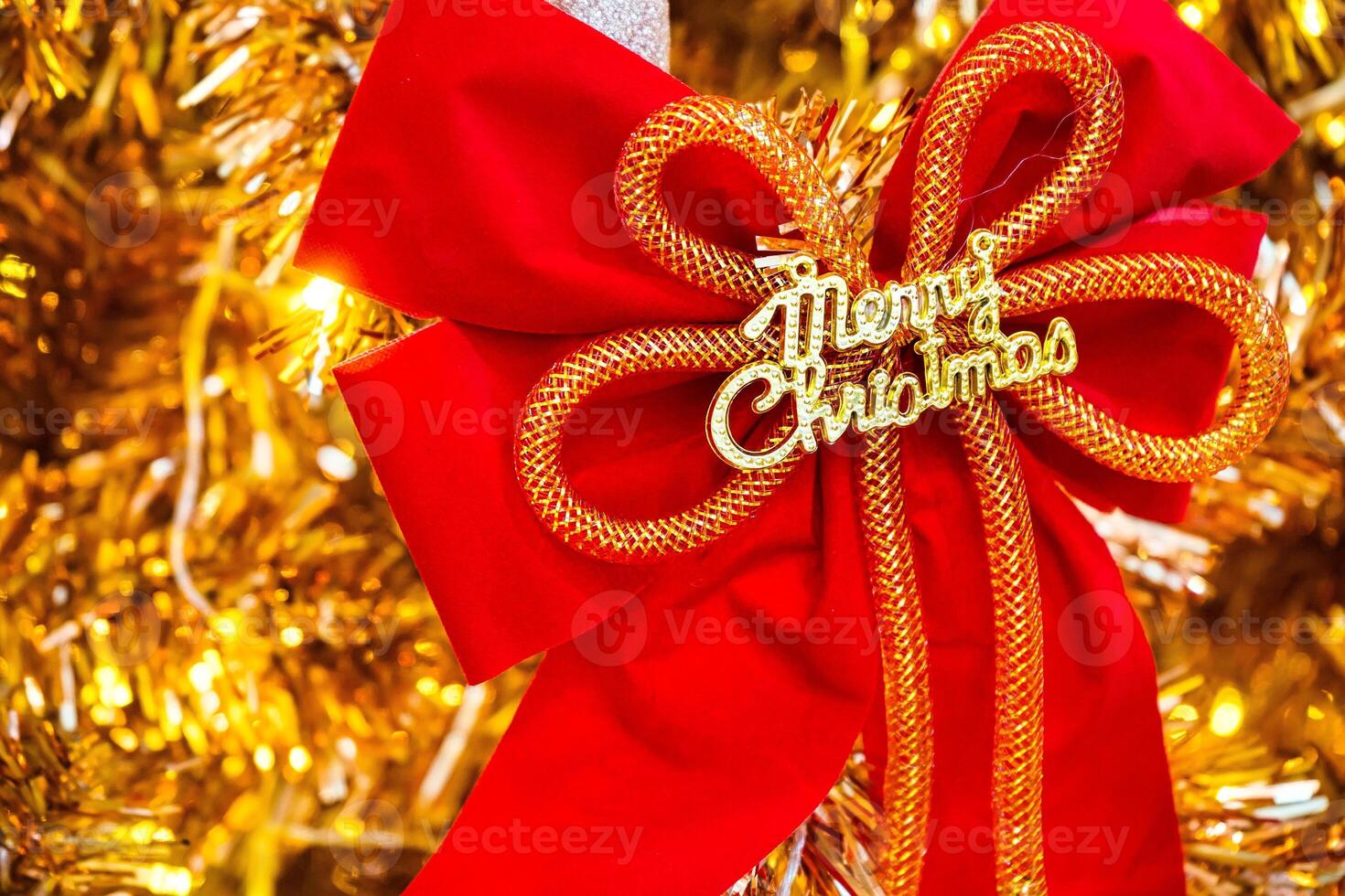 Luxurious Golden Christmas Tree Adorned with Sparkling Ornaments for the Holidays photo