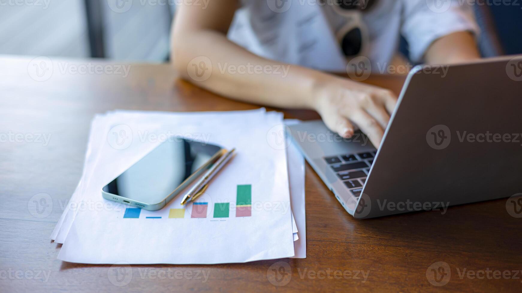 Business woman working from home using laptop online meeting in home office, Closeup image of a woman working and typing on laptop computer keyboard on the table. photo