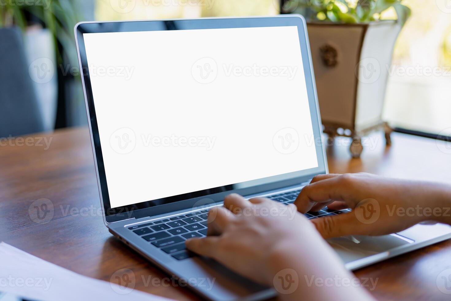 Human hand use laptop and looking at it, Blank screen tablet with white background for advertising text, Woman using laptop contact business search information, Marketing and creative design. photo