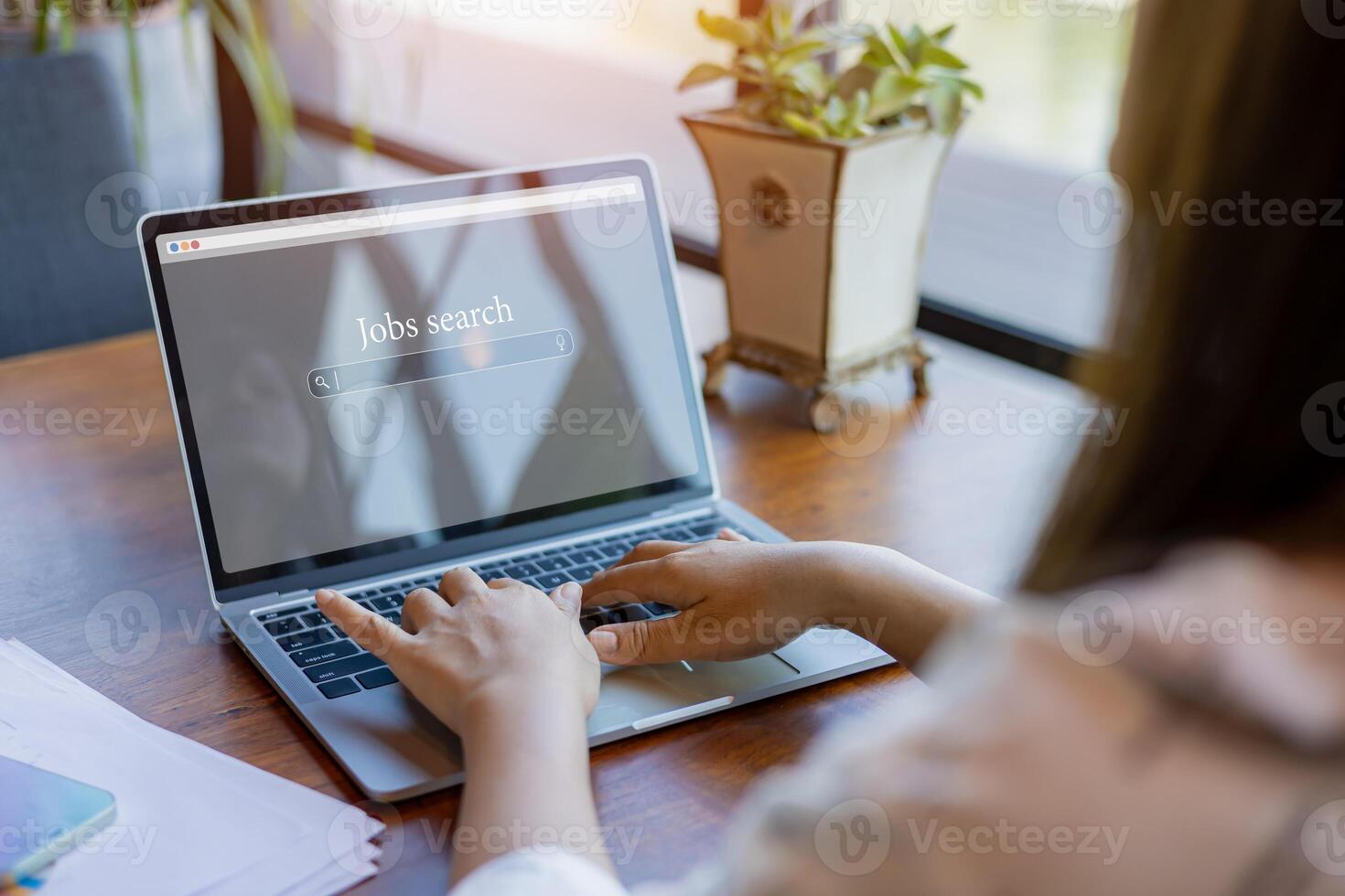 Woman looking at online website by laptop computer, Job search concept, Find your career, People searching for vacancies or position on the internet, Finding jobs, Unemployed and poor economy. photo